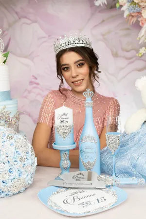 Light blue quinceanera brindis package with bottle and candle